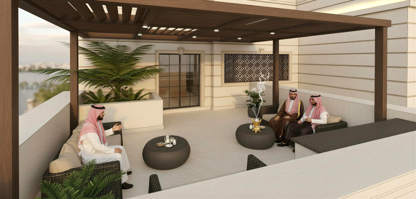 تصميم داخلي لمجلس رسمي بمقاعد جلوس تقليدية على امتداد جدران بسجاد مزخرف ومدفأة زخرفية.