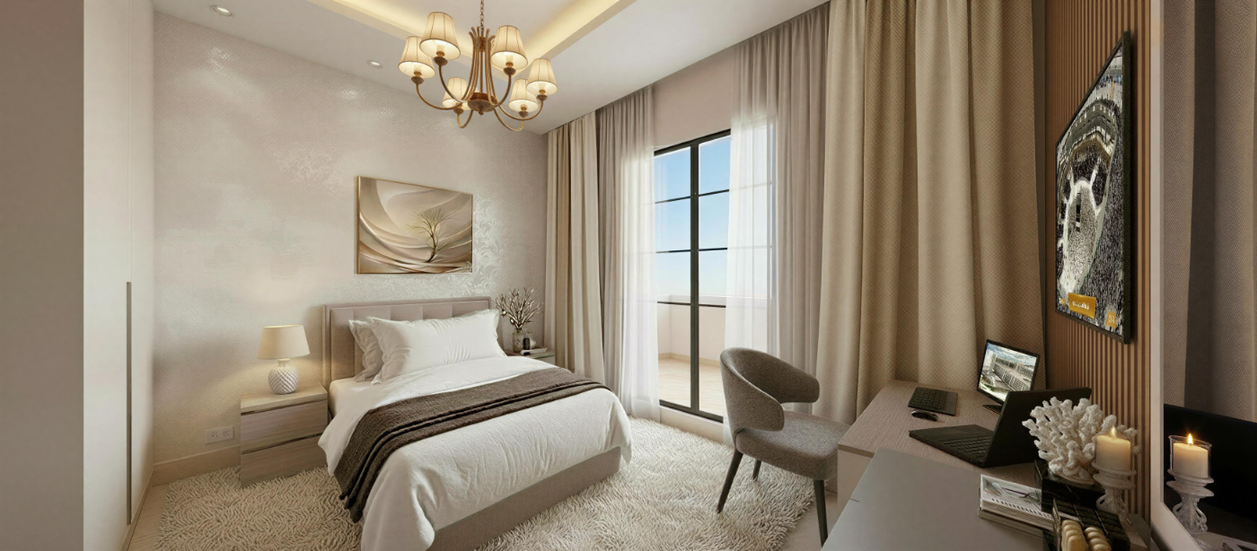 تصميم داخلي لغرفة نوم بمكتب دراسة مدمج ورف كتب وإضاءة معلّقة هندسية.