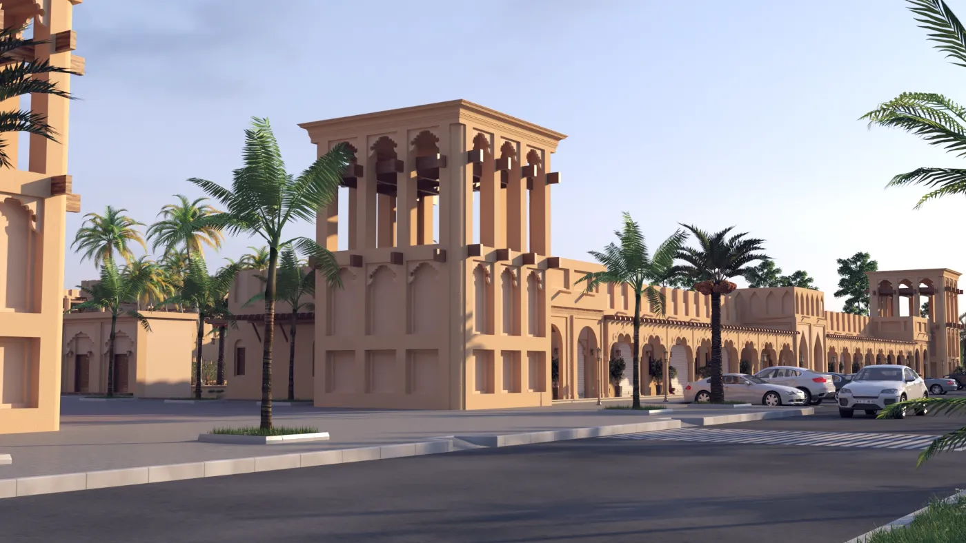 برجيل تراثي يقوم بجوار صف من الواجهات ذات الأروقة، مع أشجار النخيل والمواقف على امتداد الشارع.